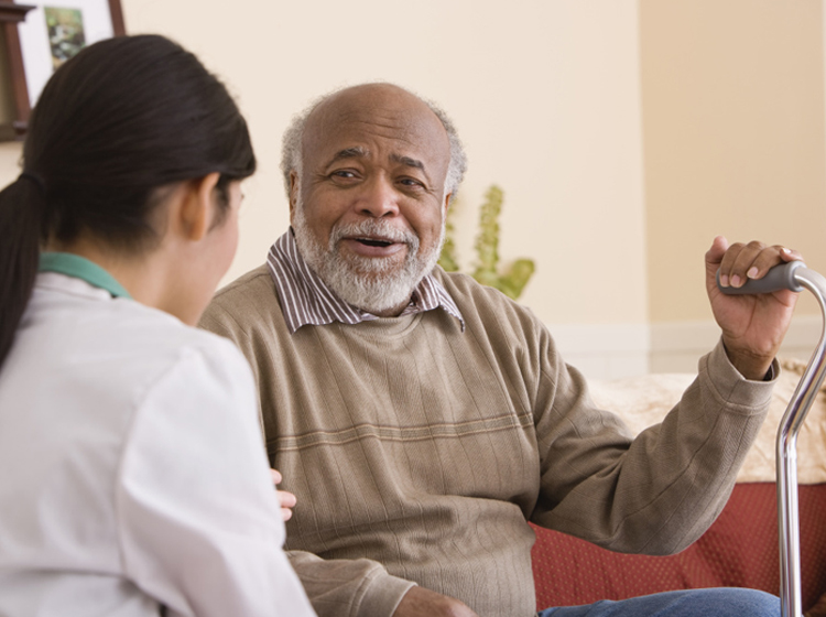 a man talking to his aetna medicare healthcare provider about medicare preventive care services